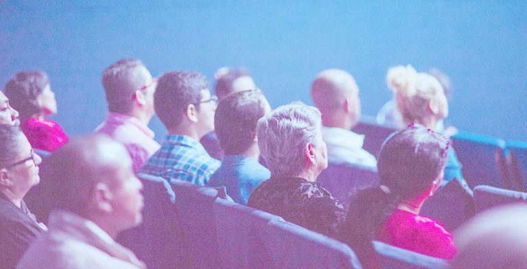 Many different types of people watching the film
